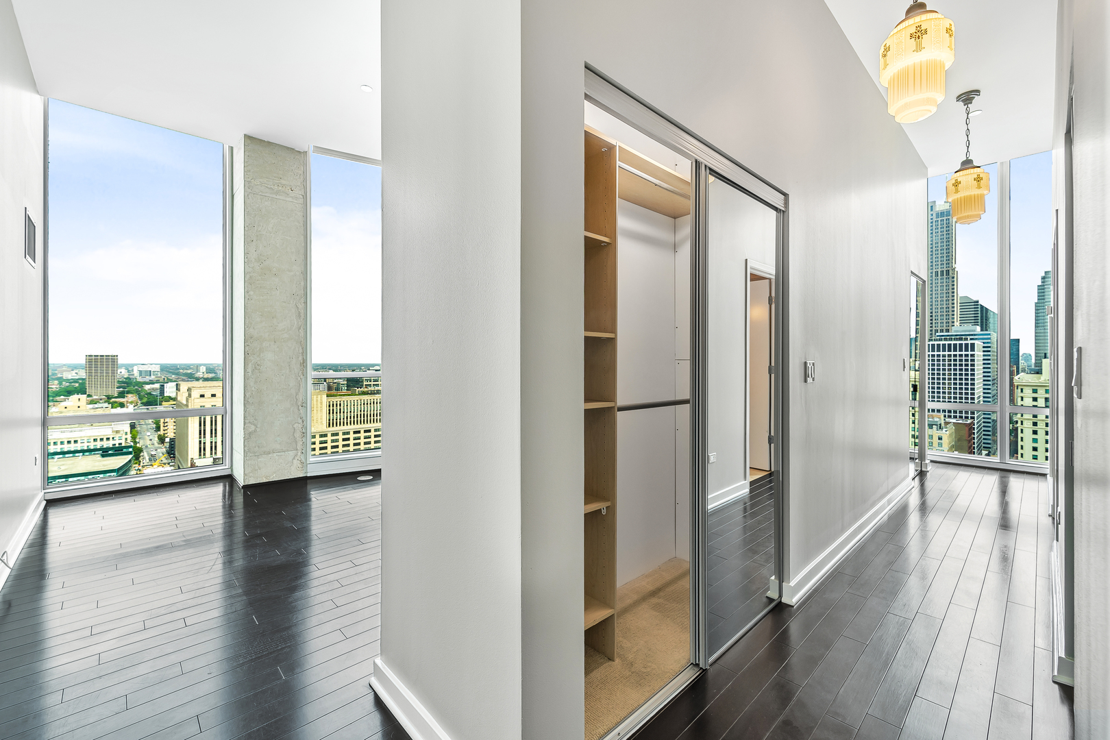 611 South Wells Street, Unit 3102 Chicago, IL 60607 - Photo 14 of 33 a view of hallway with furniture and wooden floor