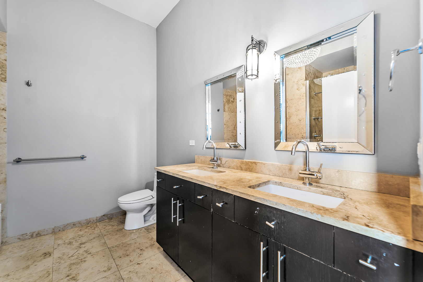 611 South Wells Street, Unit 3102 Chicago, IL 60607 - Photo 17 of 33 a bathroom with a granite countertop sink a toilet and a mirror