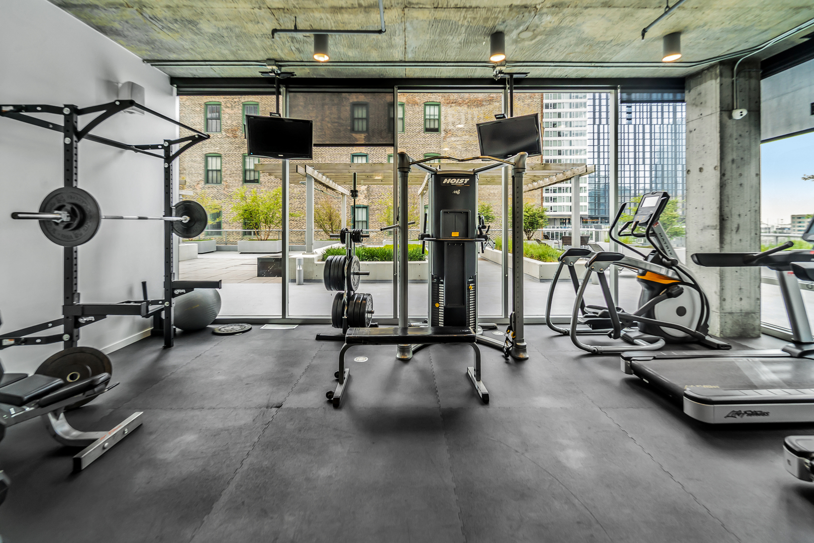 611 South Wells Street, Unit 3102 Chicago, IL 60607 - Photo 27 of 33 a view of a room with gym equipment