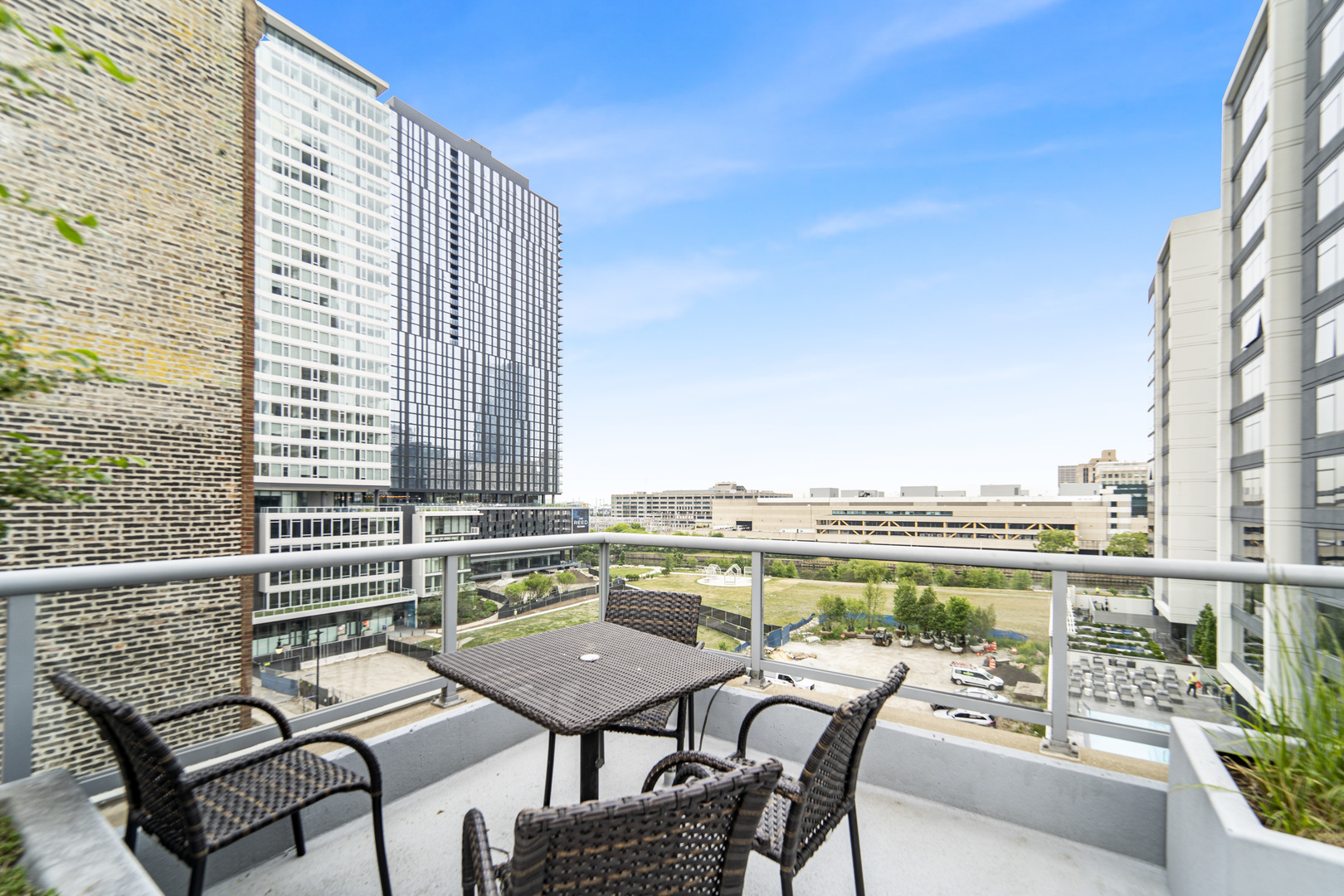 611 South Wells Street, Unit 3102 Chicago, IL 60607 - Photo 31 of 33 a view of a balcony with table and chairs