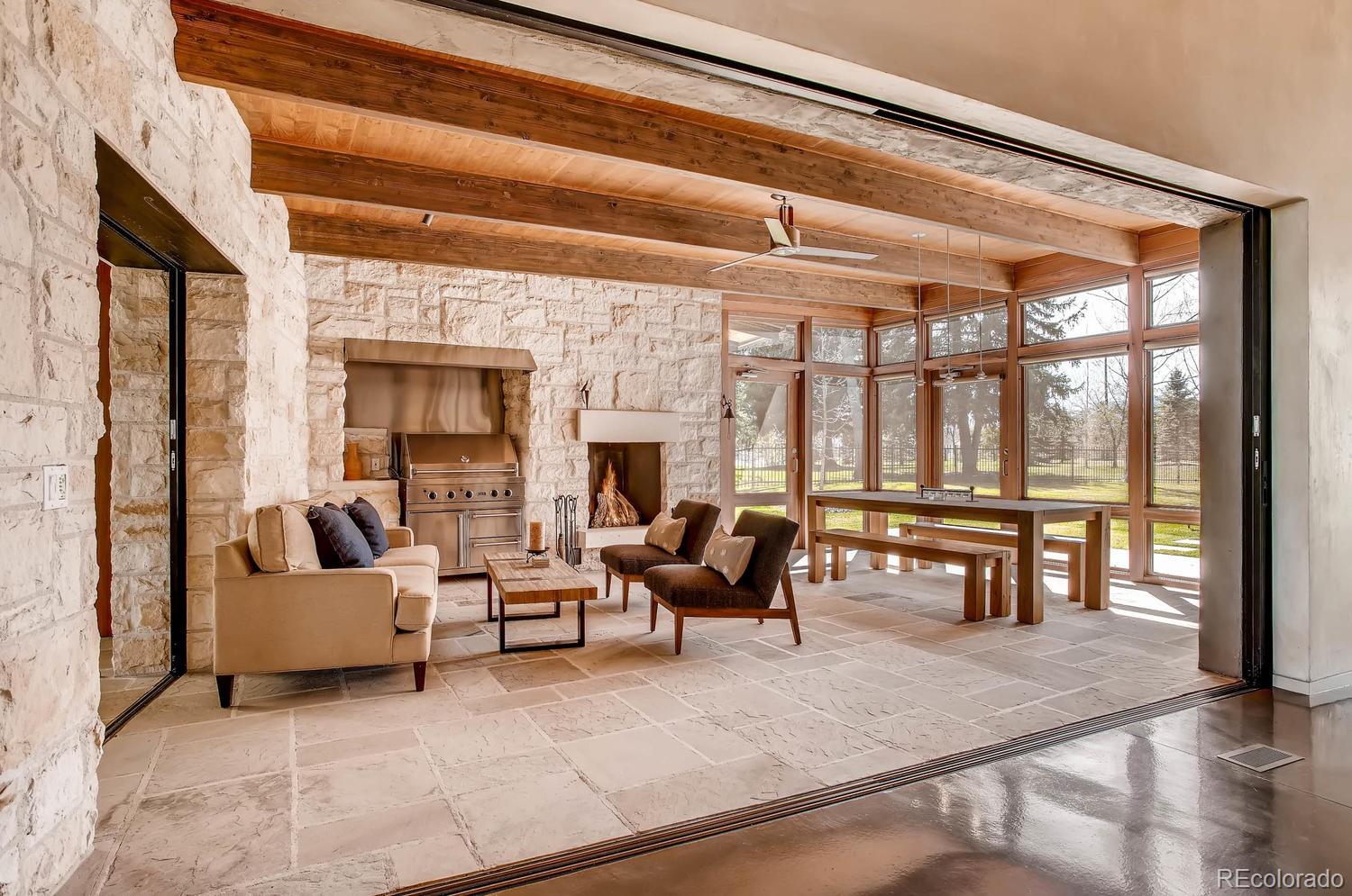 7983 Valmont Road Boulder, CO 80301 - Photo 11 of 31 a living room with furniture and large windows