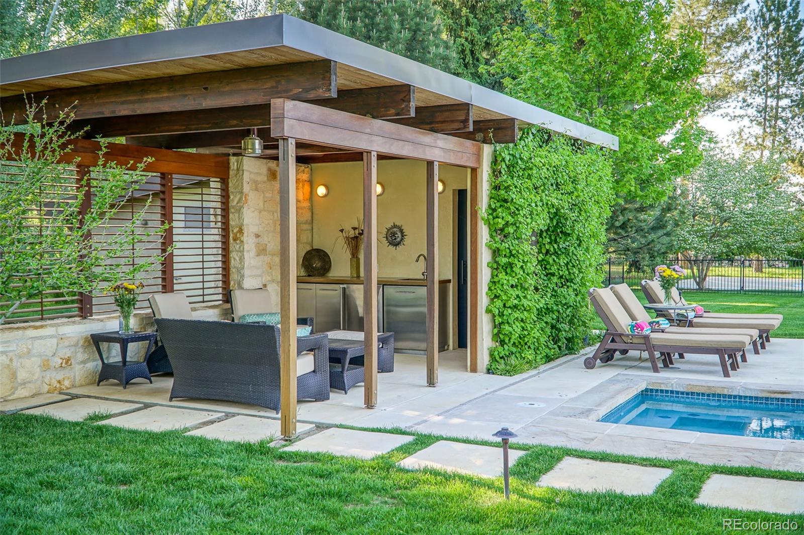 7983 Valmont Road Boulder, CO 80301 - Photo 13 of 31 a view of a chair and table in backyard of the house