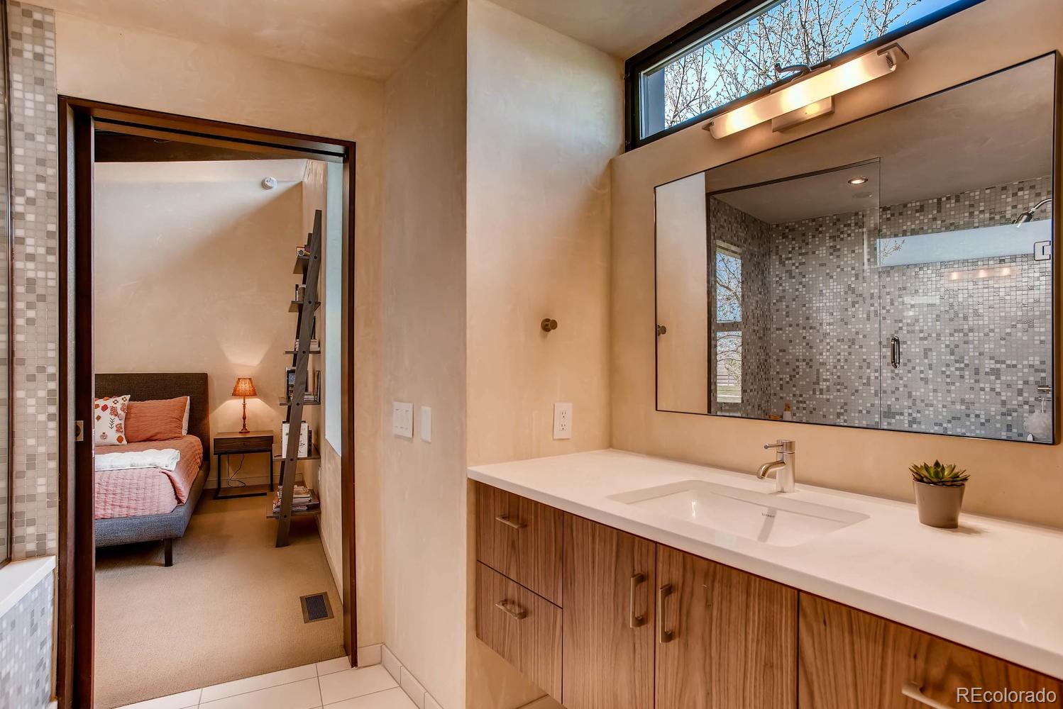7983 Valmont Road Boulder, CO 80301 - Photo 24 of 31 a en suite bathroom with a sink and a mirror