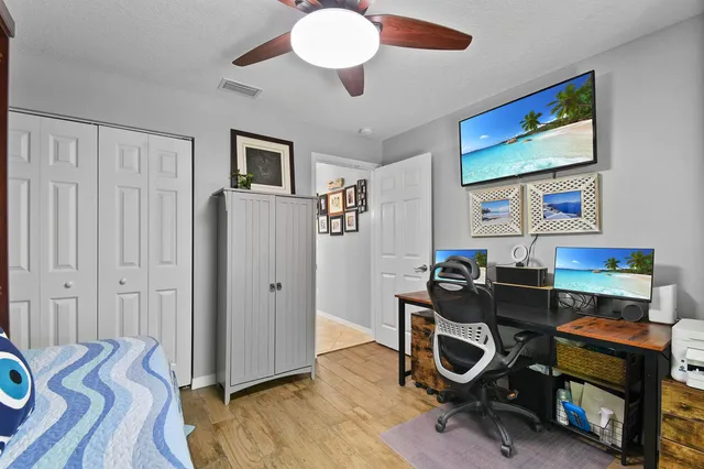 a bedroom with a bed and a dresser