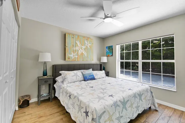 a living room filled with furniture and a floor to ceiling window