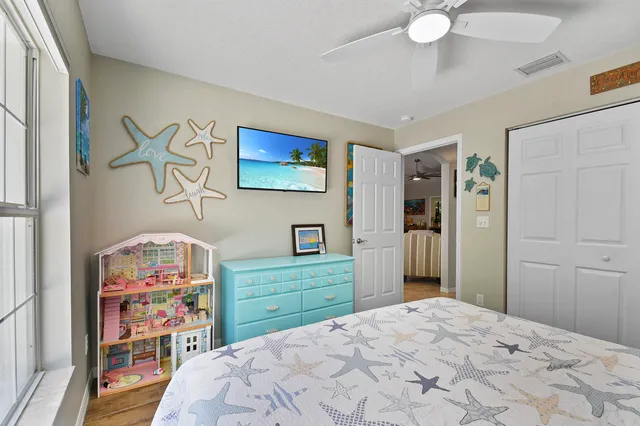 a living room with patio chairs and a large window