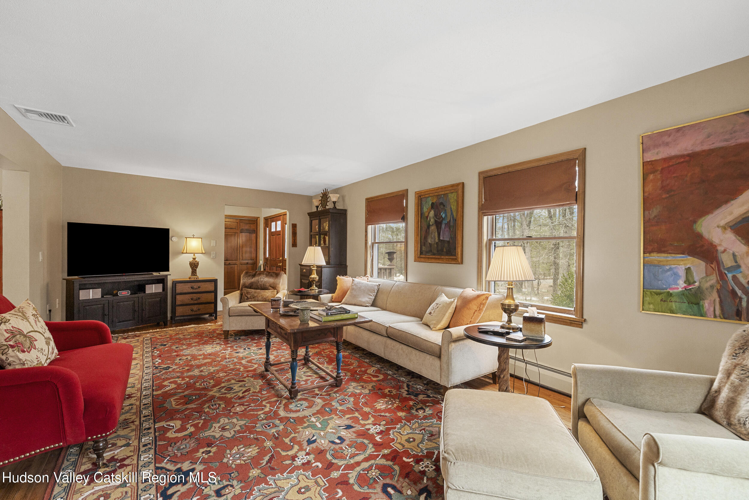 4 Mountain View Drive Kerhonkson, NY 12446 - Photo 16 of 37 a living room with furniture and a flat screen tv