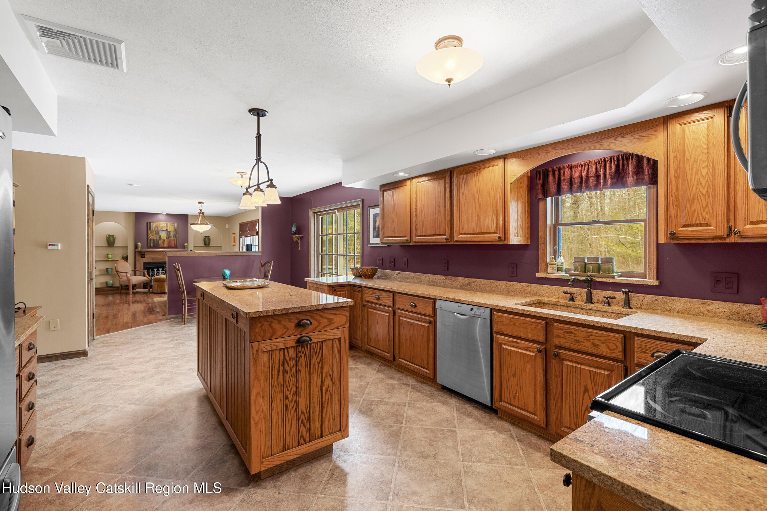 4 Mountain View Drive Kerhonkson, NY 12446 - Photo 25 of 37 a large kitchen with kitchen island a sink stove and wooden cabinets