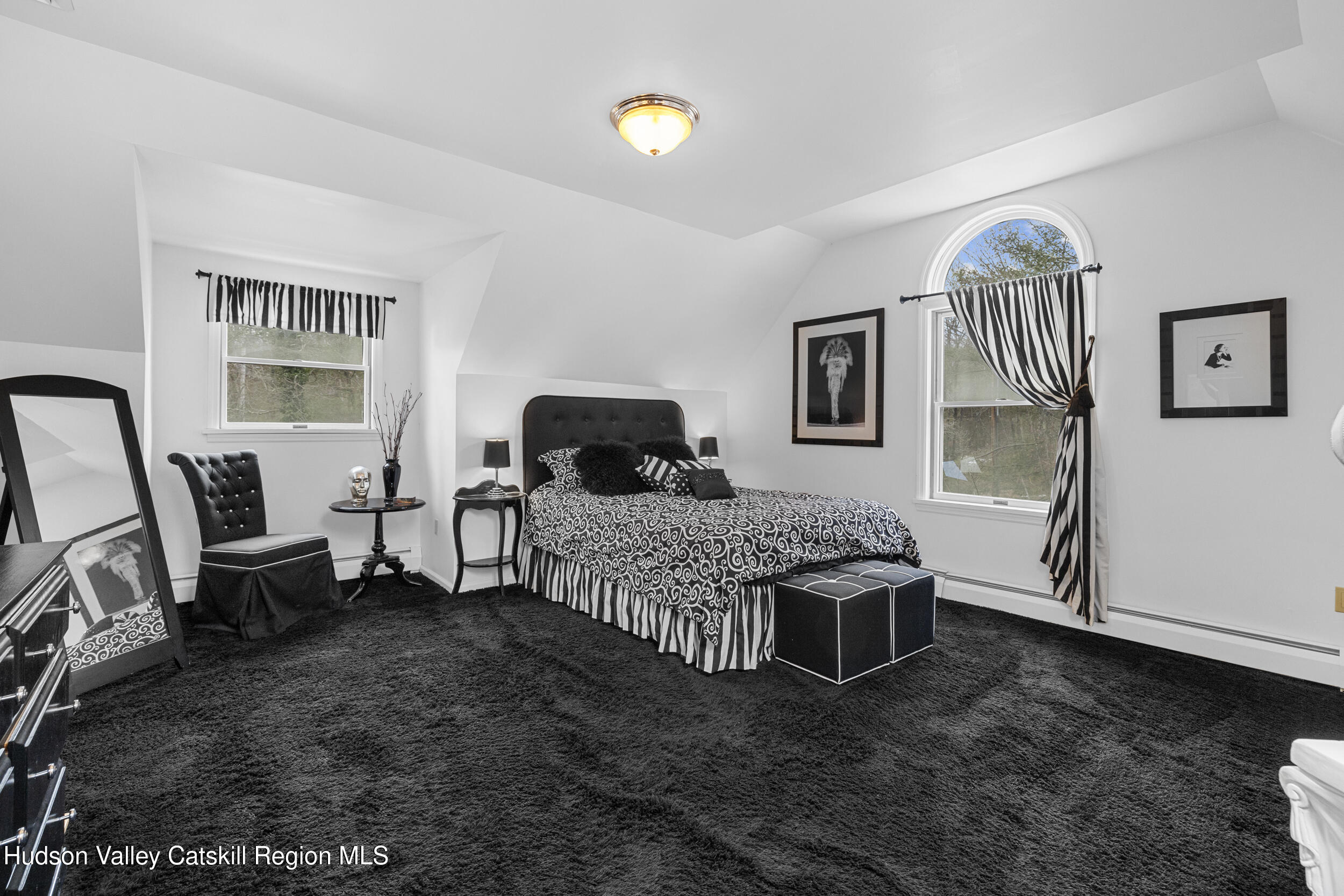 4 Mountain View Drive Kerhonkson, NY 12446 - Photo 29 of 37 a bedroom with a bed and wooden floor