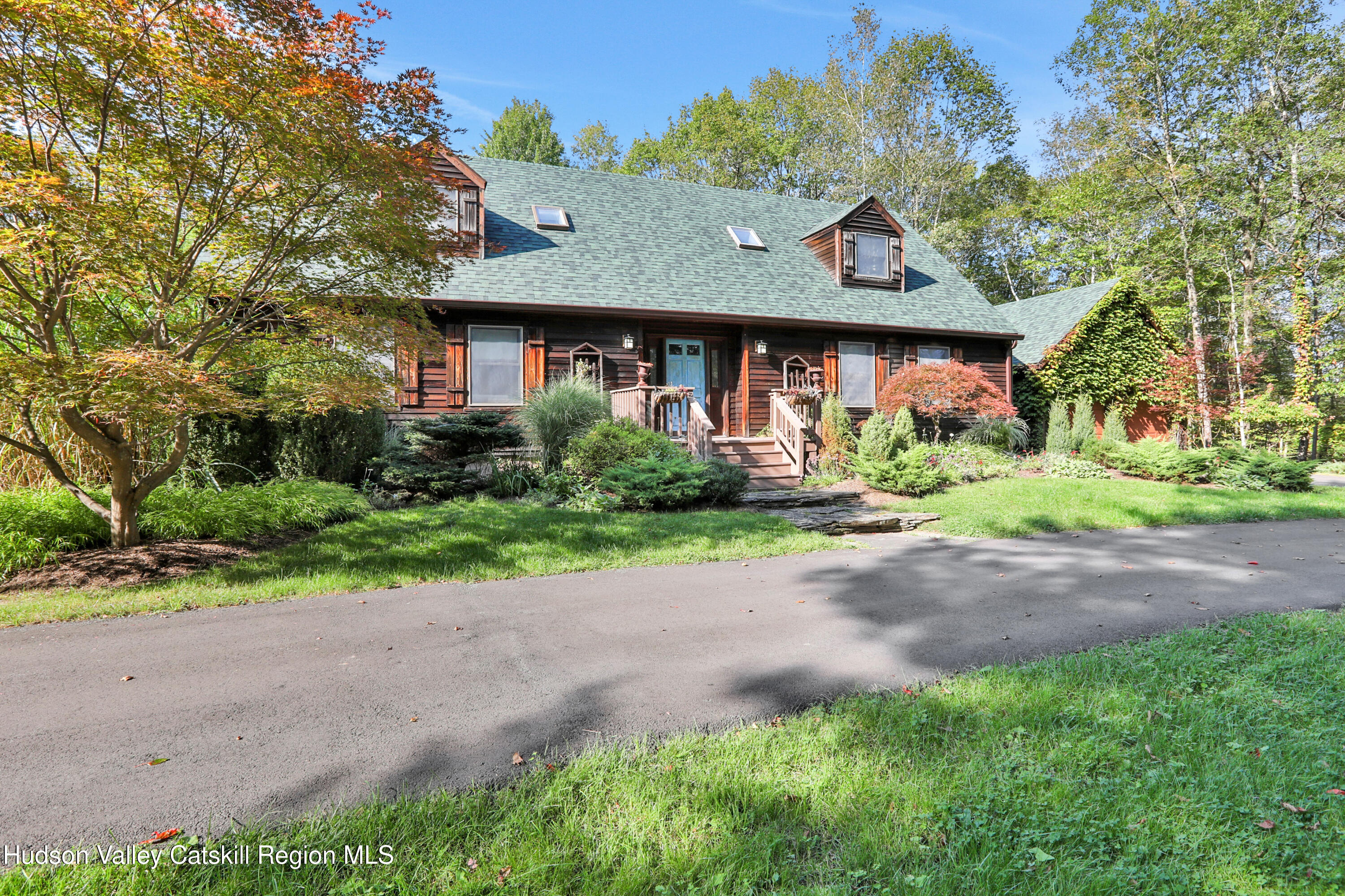 4 Mountain View Drive Kerhonkson, NY 12446 - Photo 3 of 37 a front view of a house with a yard and a garage