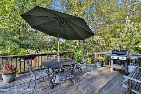 an outdoor space with furniture and umbrella