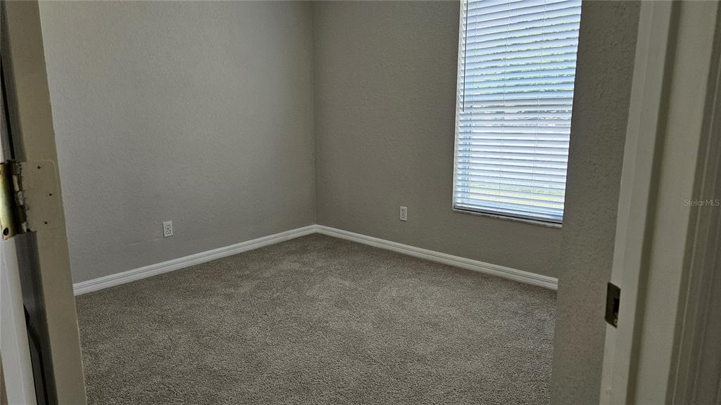 108 Brittany Road Mascotte, FL 34753 - Photo 10 of 17 an empty room with a window