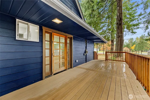 a view of backyard with a large tree
