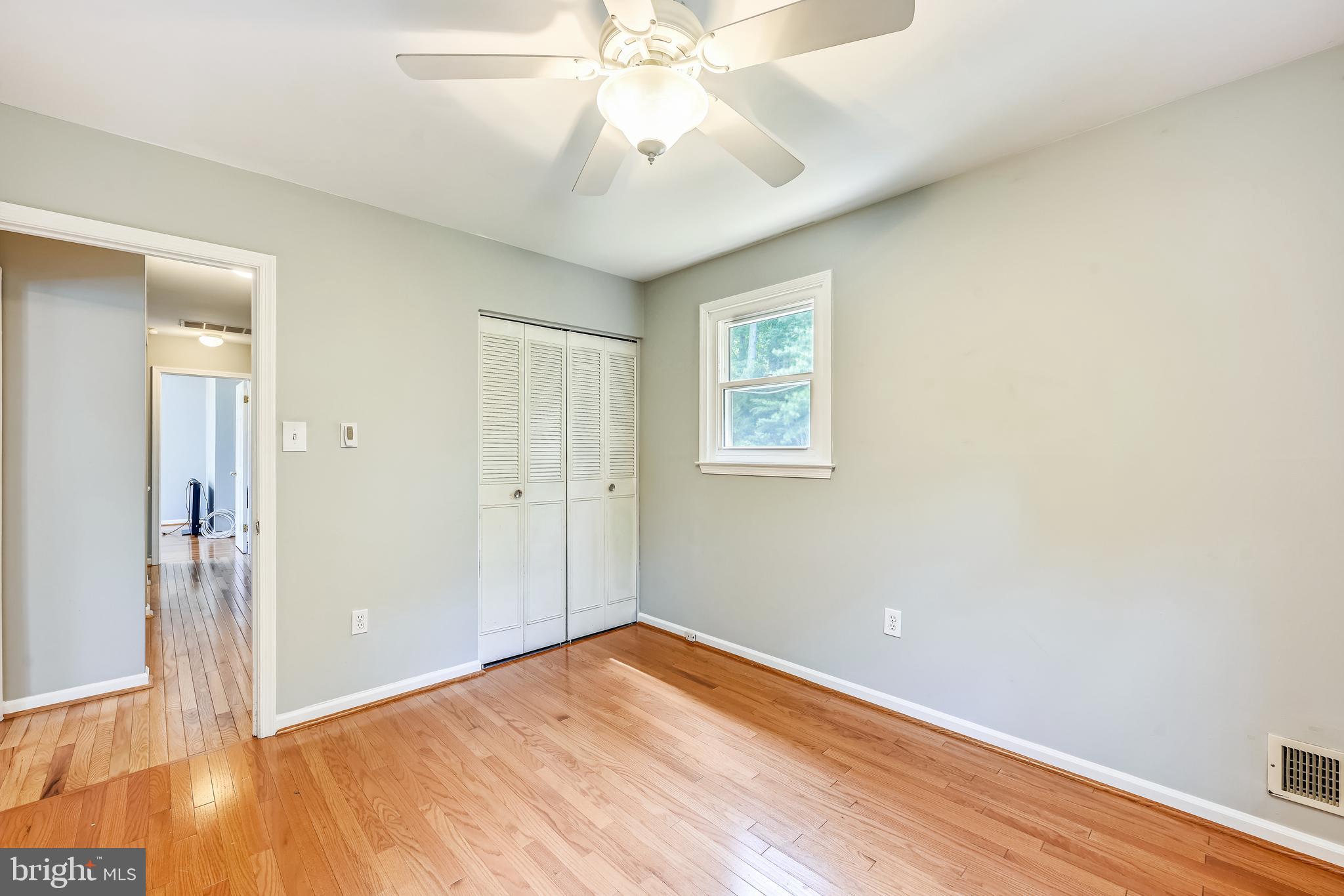 2116 Kings House Road Silver Spring, MD 20905 - Photo 27 of 37 wooden floor in an empty room with a window