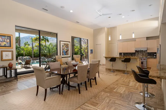 a kitchen with stainless steel appliances granite countertop a sink and a stove