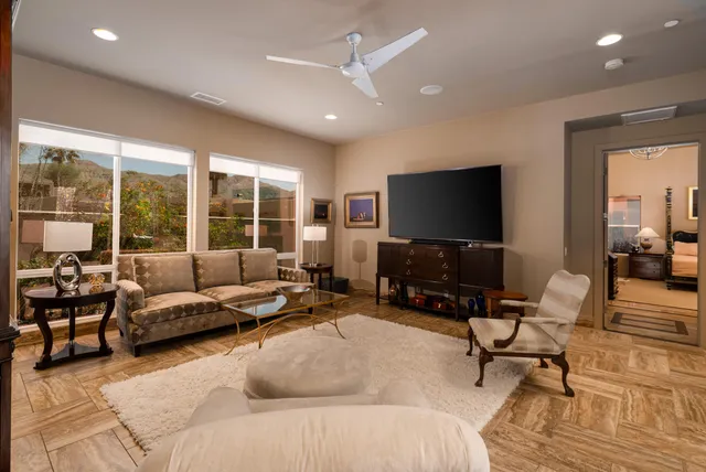 a bed room with a bed and a large window