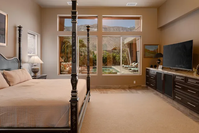 a bathroom with a sink and a glass door shower