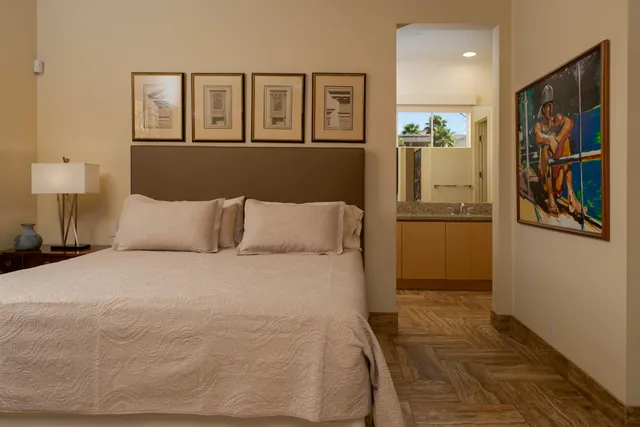 a bedroom with a bed and a dresser