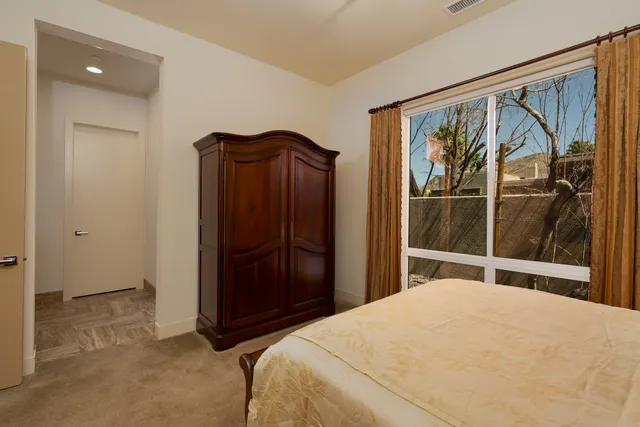 a view of a backyard with plants and patio