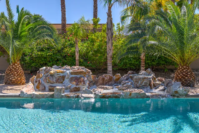 a view of a swimming pool with a patio