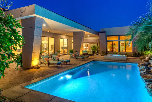 front view of a house with potted plants