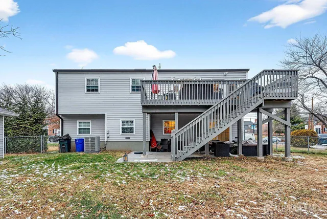 a view of a house with wooden deck