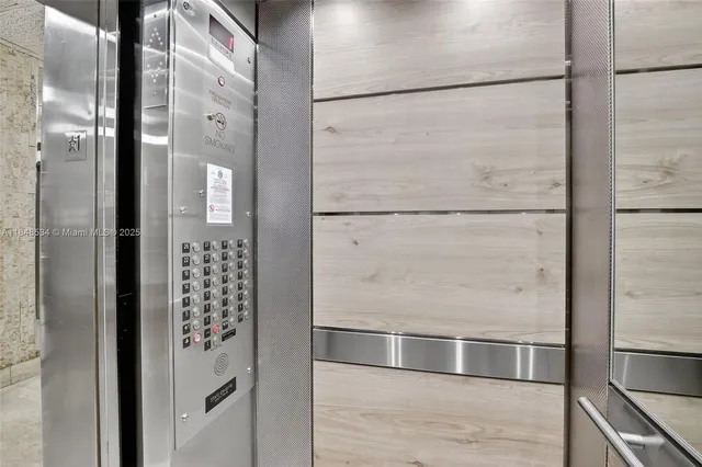 a bathroom with a shower and a glass door