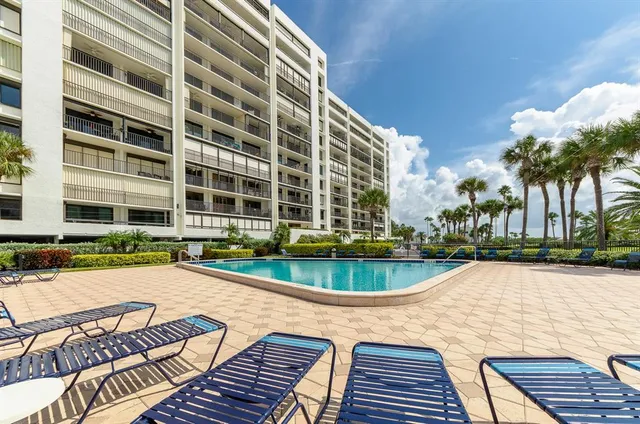 a view of a swimming pool and lounge chair