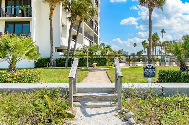 a swimming pool with an outdoor seating