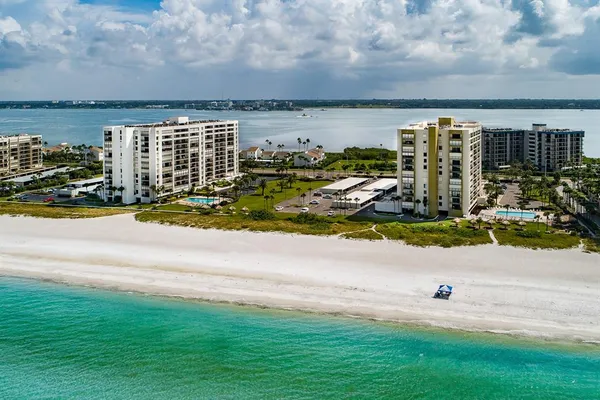 a view of swimming pool with outdoor seating and yard in back