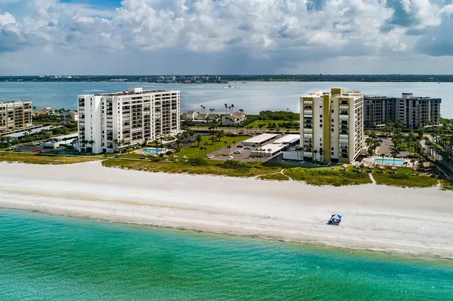 a view of swimming pool with outdoor seating and yard in back