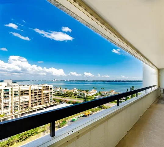 a kitchen with a sink a counter top space stainless steel appliances and cabinets