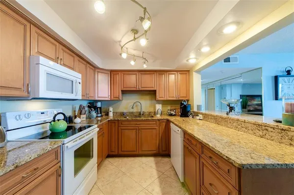 a view of a swimming pool with outdoor seating