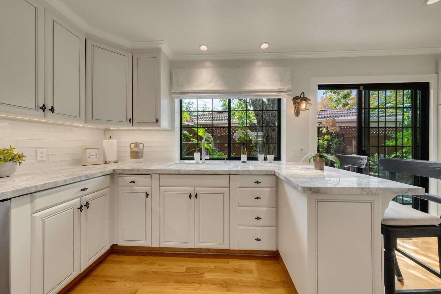 680 Cambrian Drive Campbell, CA 95008 - Photo 18 of 62 a kitchen with sink cabinets and living room view