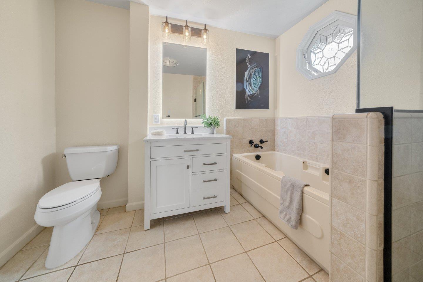 680 Cambrian Drive Campbell, CA 95008 - Photo 28 of 62 a spacious bathroom with a toilet a sink a mirror and a bathtub