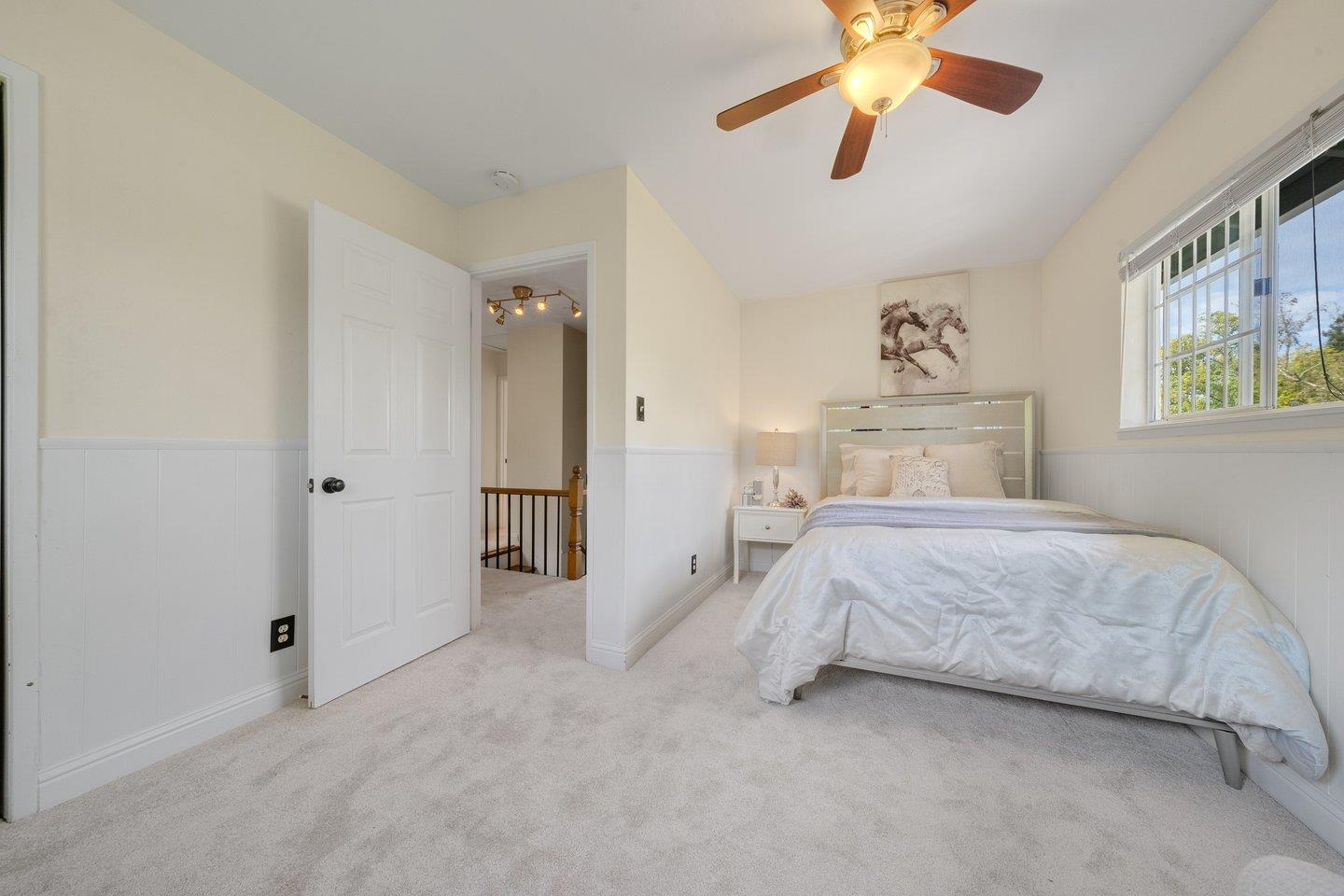 680 Cambrian Drive Campbell, CA 95008 - Photo 39 of 62 a bedroom with a bed and a chandelier