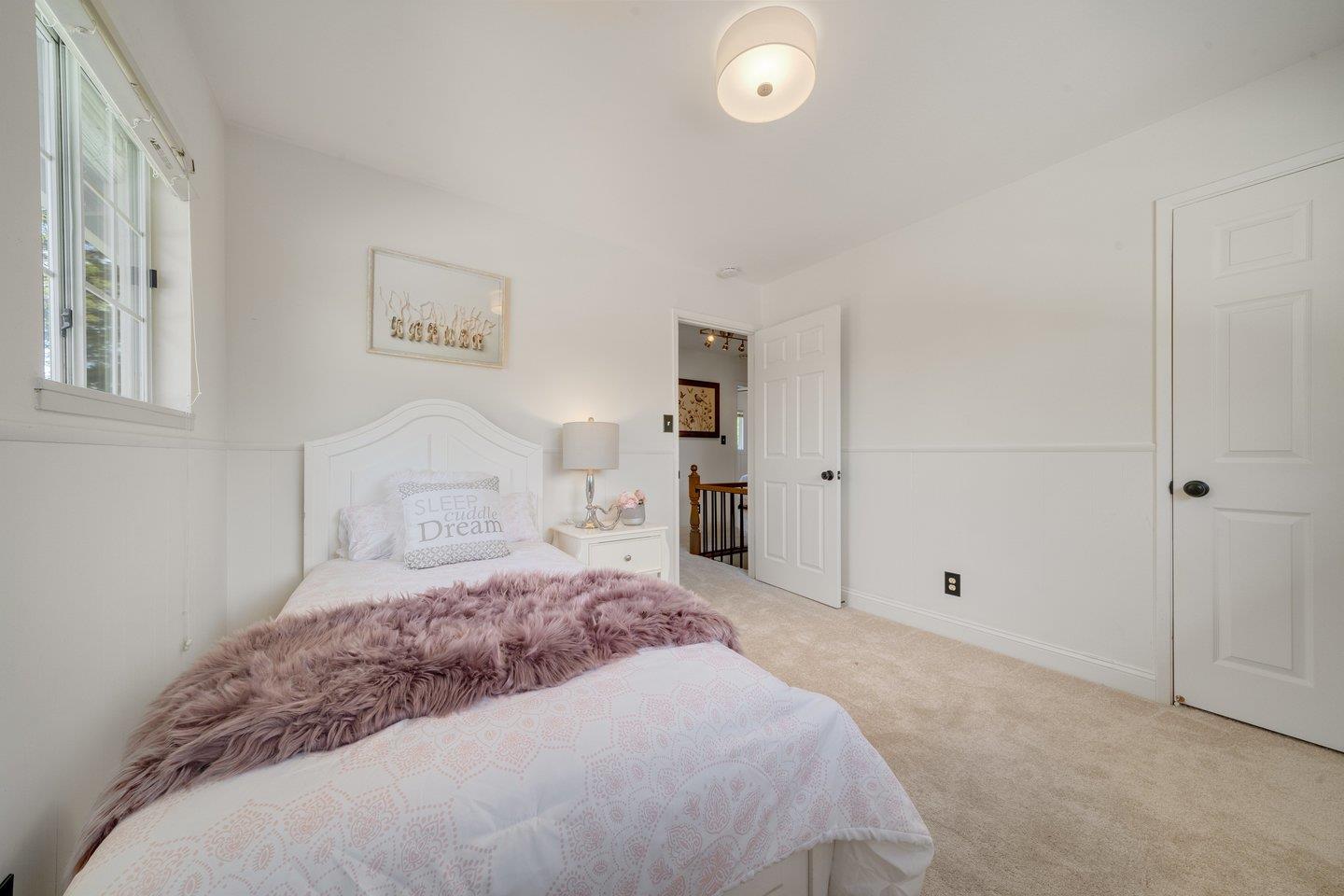 680 Cambrian Drive Campbell, CA 95008 - Photo 41 of 62 a bedroom with a large bed and a chandelier