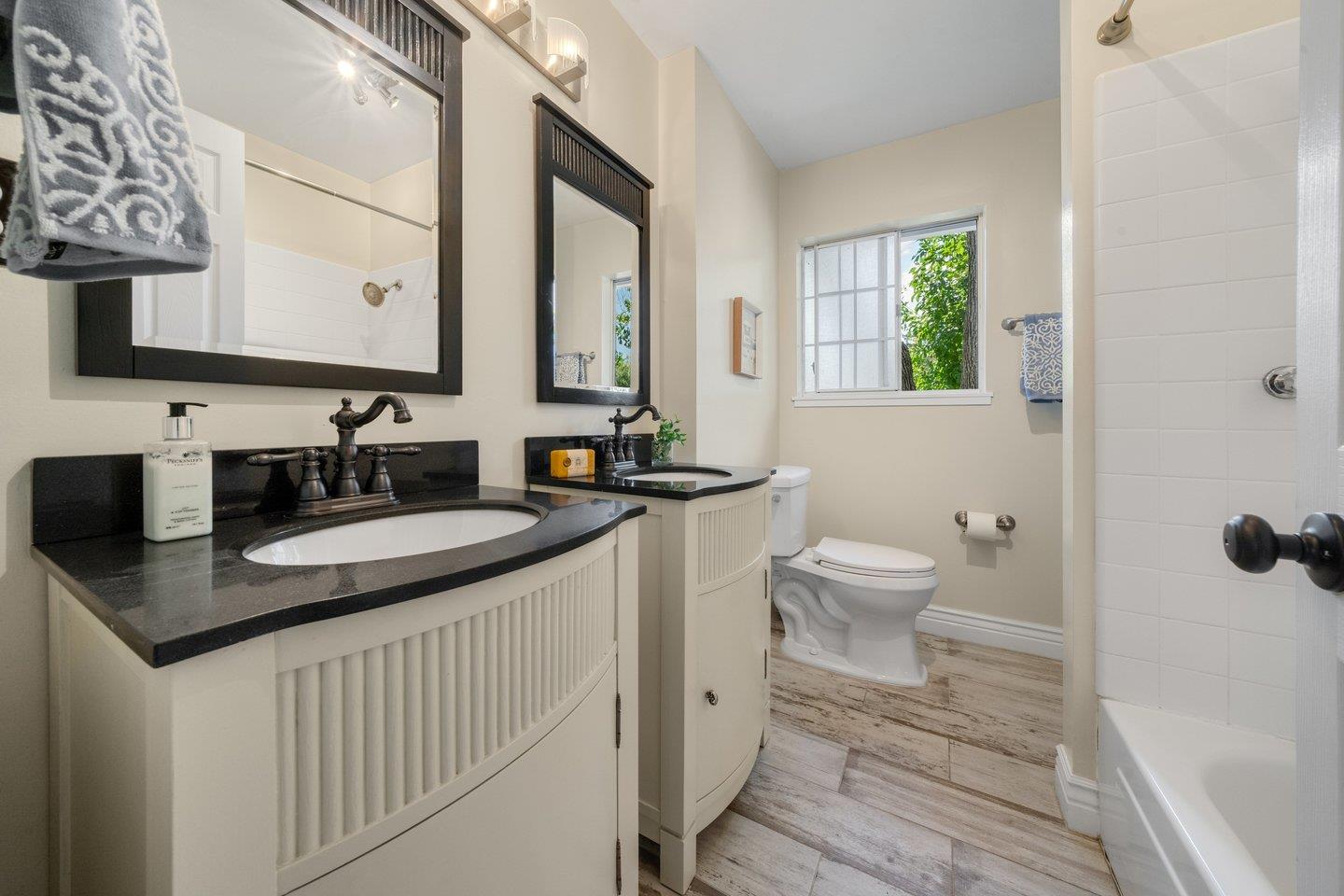 680 Cambrian Drive Campbell, CA 95008 - Photo 44 of 62 a bathroom with a granite countertop sink a toilet and a mirror