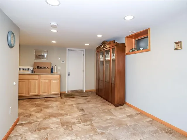 a view of kitchen with cabinets and wooden floor