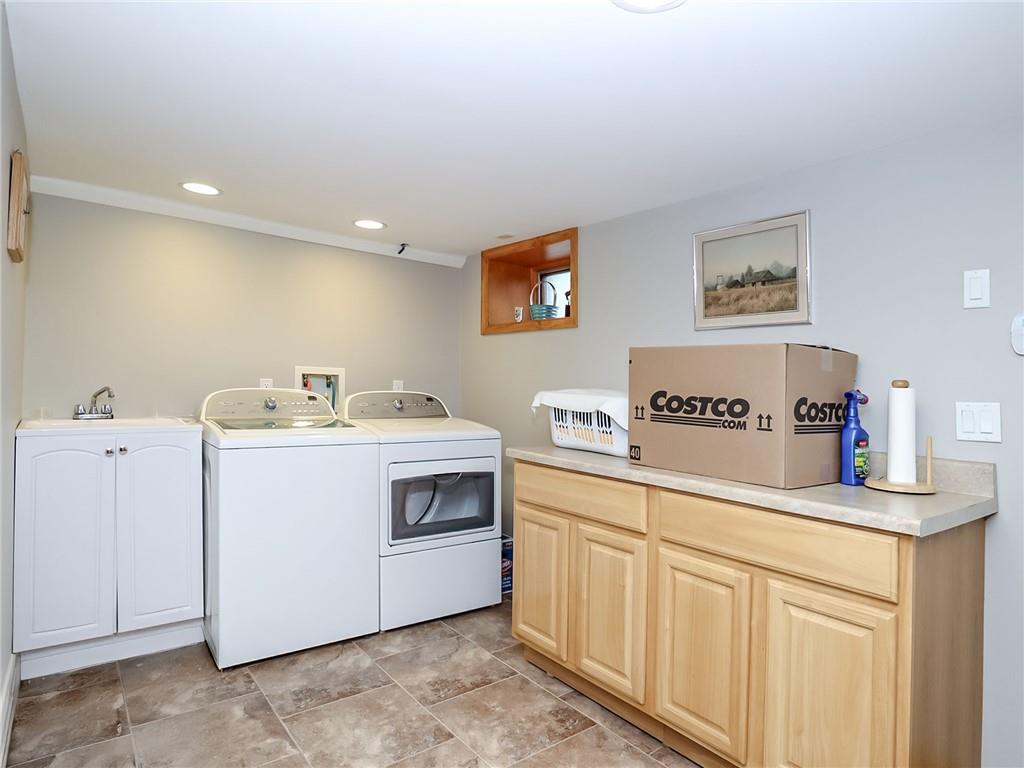 480 Van Sicklen Street Brooklyn, NY 11223 - Photo 16 of 31 a utility room with sink dryer and washer