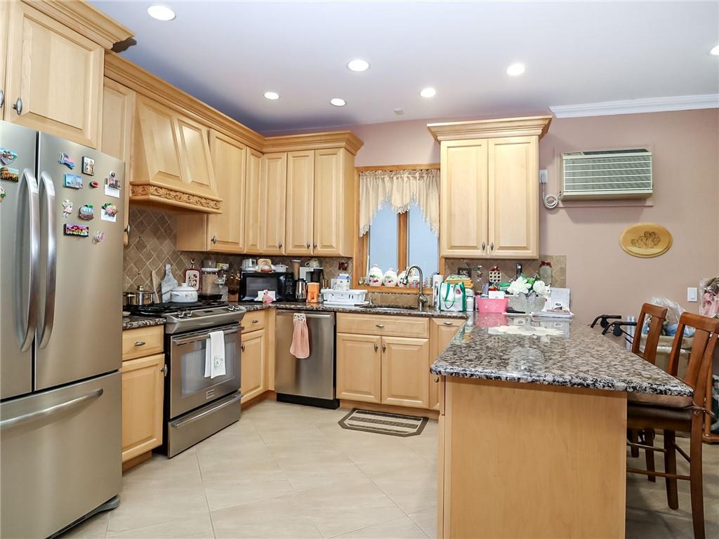 480 Van Sicklen Street Brooklyn, NY 11223 - Photo 8 of 31 a kitchen with granite countertop a sink stainless steel appliances and cabinets
