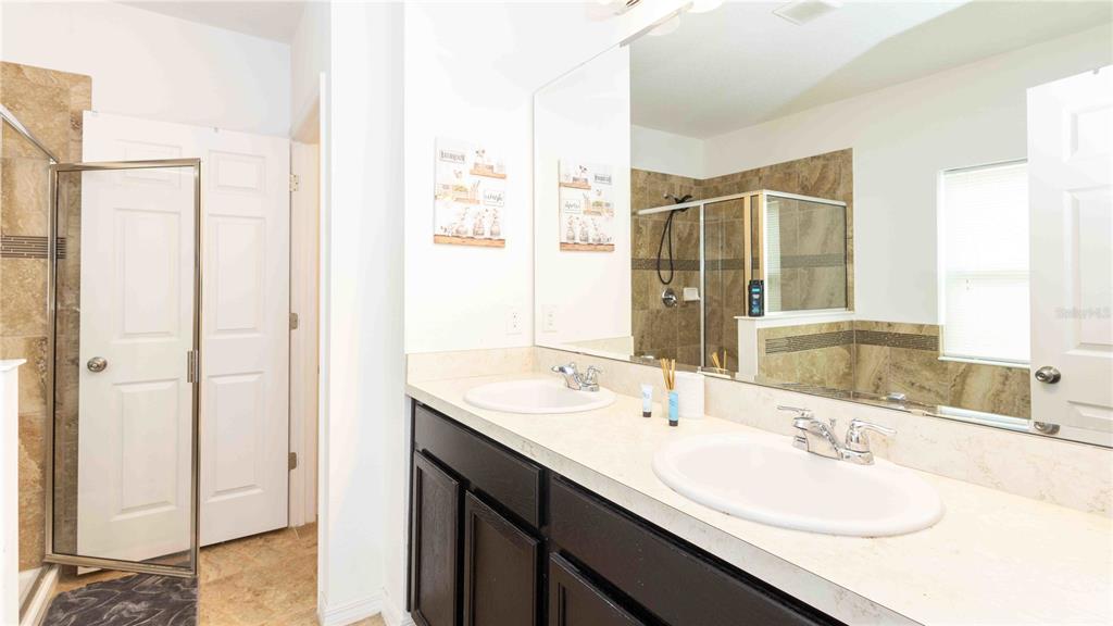 815 Montgomery Drive Davenport, FL 33897 - Photo 11 of 24 a bathroom with a sink and a mirror