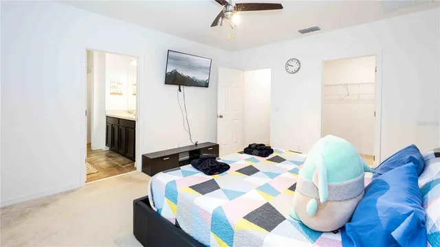 a bedroom with a bed and a mirror