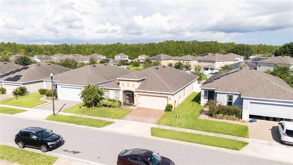 815 Montgomery Drive Davenport, FL 33897 - Photo 22 of 24 a front view of a house with a garden and yard