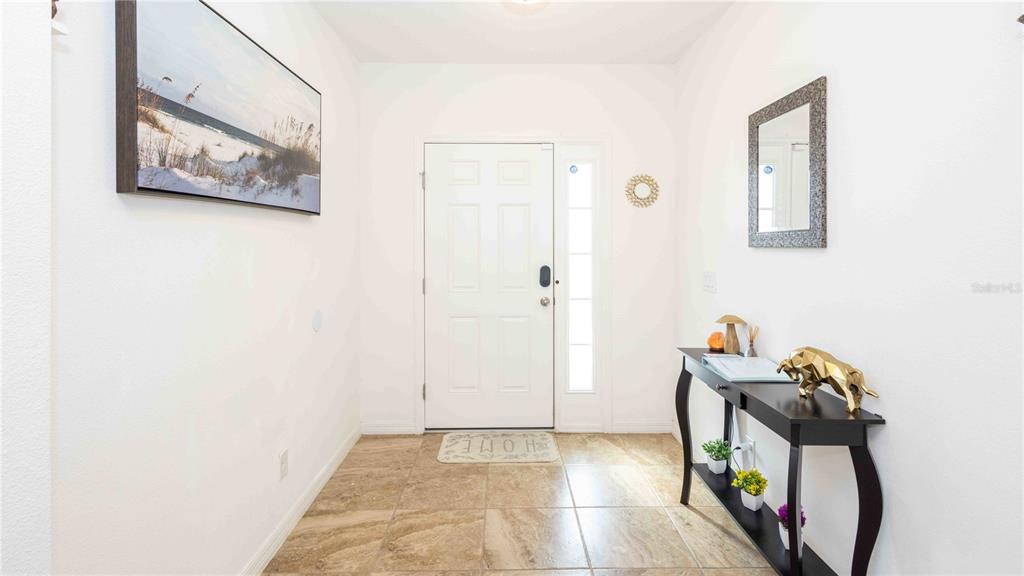 815 Montgomery Drive Davenport, FL 33897 - Photo 3 of 24 a view of a hallway with workspace