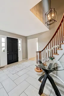 a view of entryway and hall with dining room