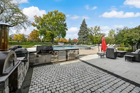 a view of a yard with sitting area