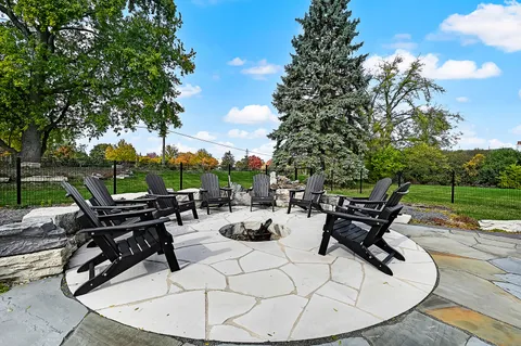 a view of a backyard with sitting area