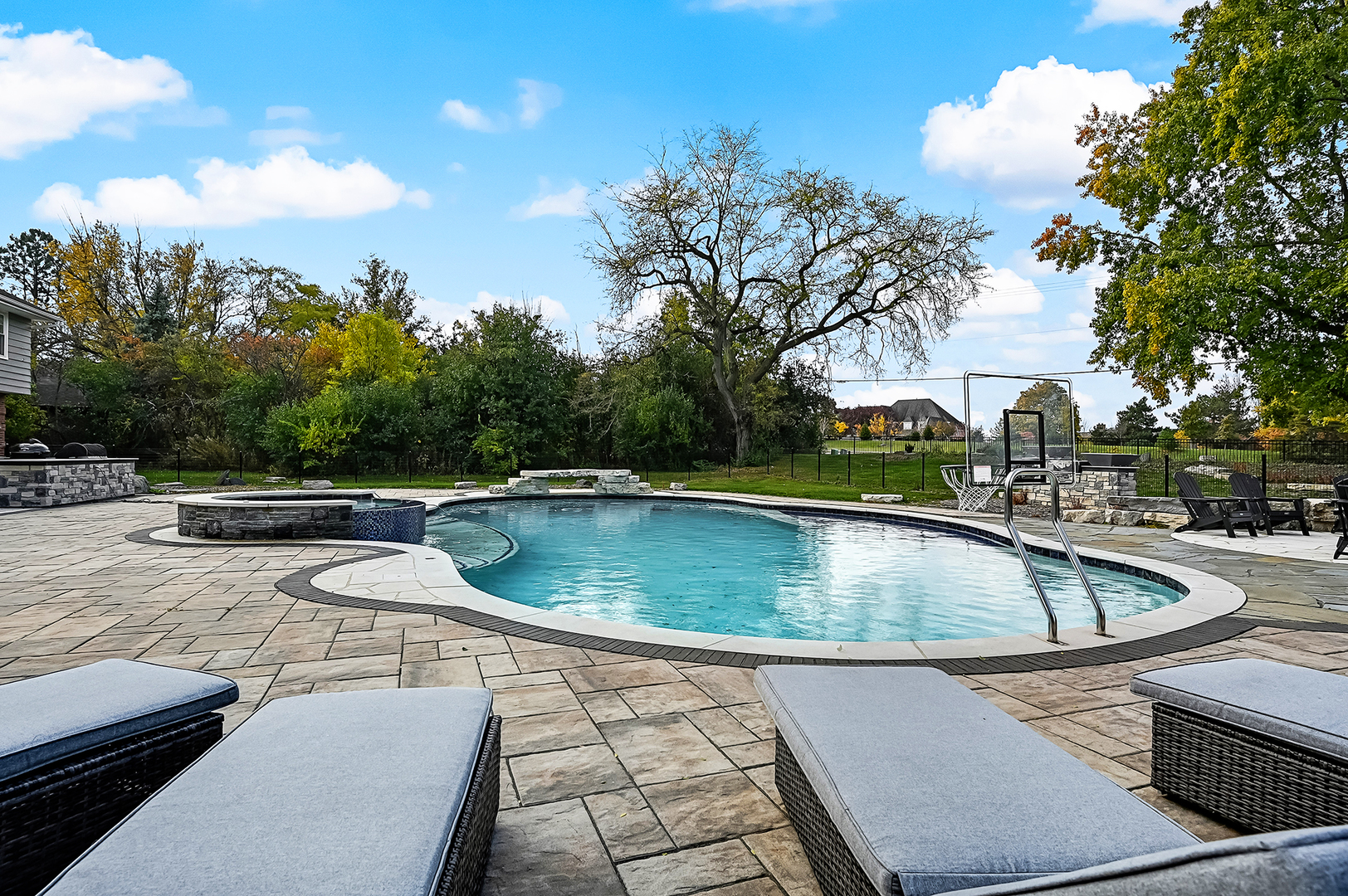 6750 County Line Lane Burr Ridge, IL 60527 - Photo 34 of 35 a view of a swimming pool with a lounge chair