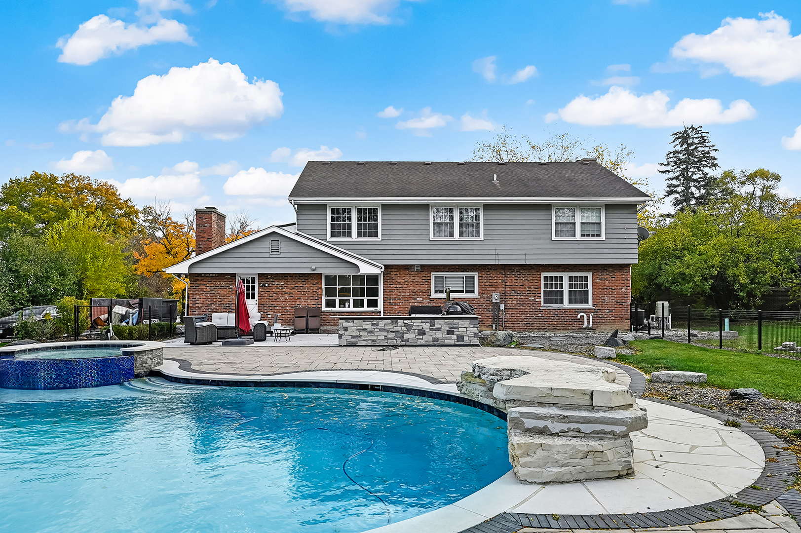 6750 County Line Lane Burr Ridge, IL 60527 - Photo 35 of 35 a house view with a seating space and garden